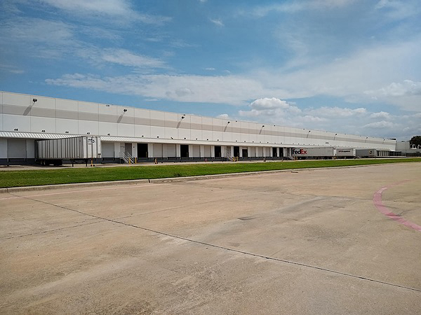 1655 Waters Ridge Dr, Exterior Building Photo - Rear of building facing south. Industrial Property for Lease - 1655 Waters Ridge Dr, Lewisville, Texas, 75057-6013 (3)